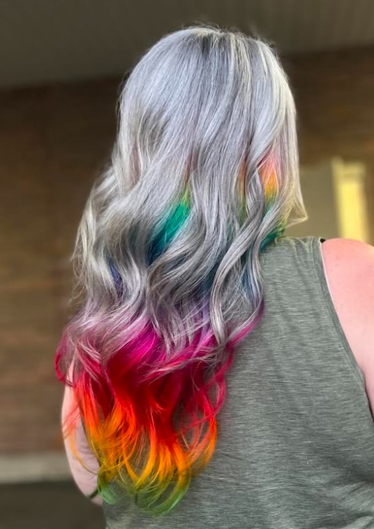 Hair by Natalie Cotta, showing rainbow hair on gray haired woman